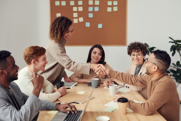 Team discussing business task at a table